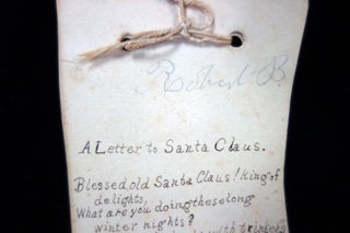 A Letter to Santa Claus – written in rhyming verse and asking for more for the poor children. A pen and ink letter written on two 9 ½” x 4 ½” stock cut in the shape of a stocking.