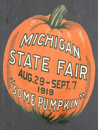 Item #270008632 Die-cut paper decal in the shape of a pumpkin promotes Michigan State